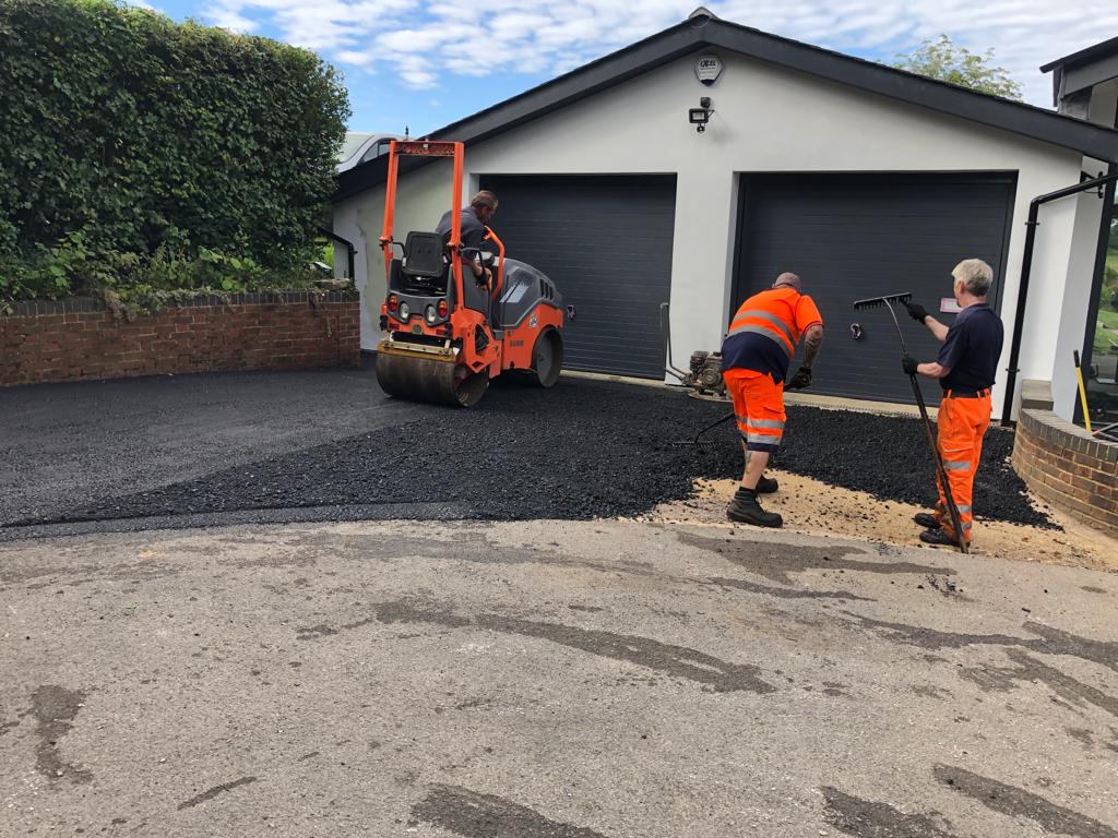 This is a photo of a bitumen driveway which is in the process of being installed by Penrith Road Tek